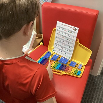 stuents learning the anthem on an instrument