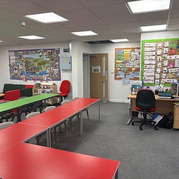 teachers desk in the classroom and student tables