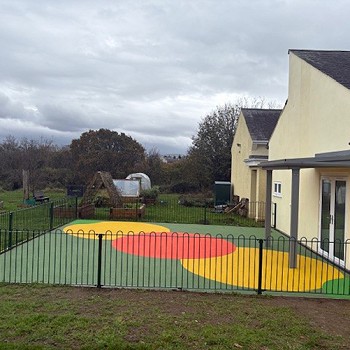 outside playing area with colourful flooring