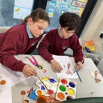 Two pupils painting